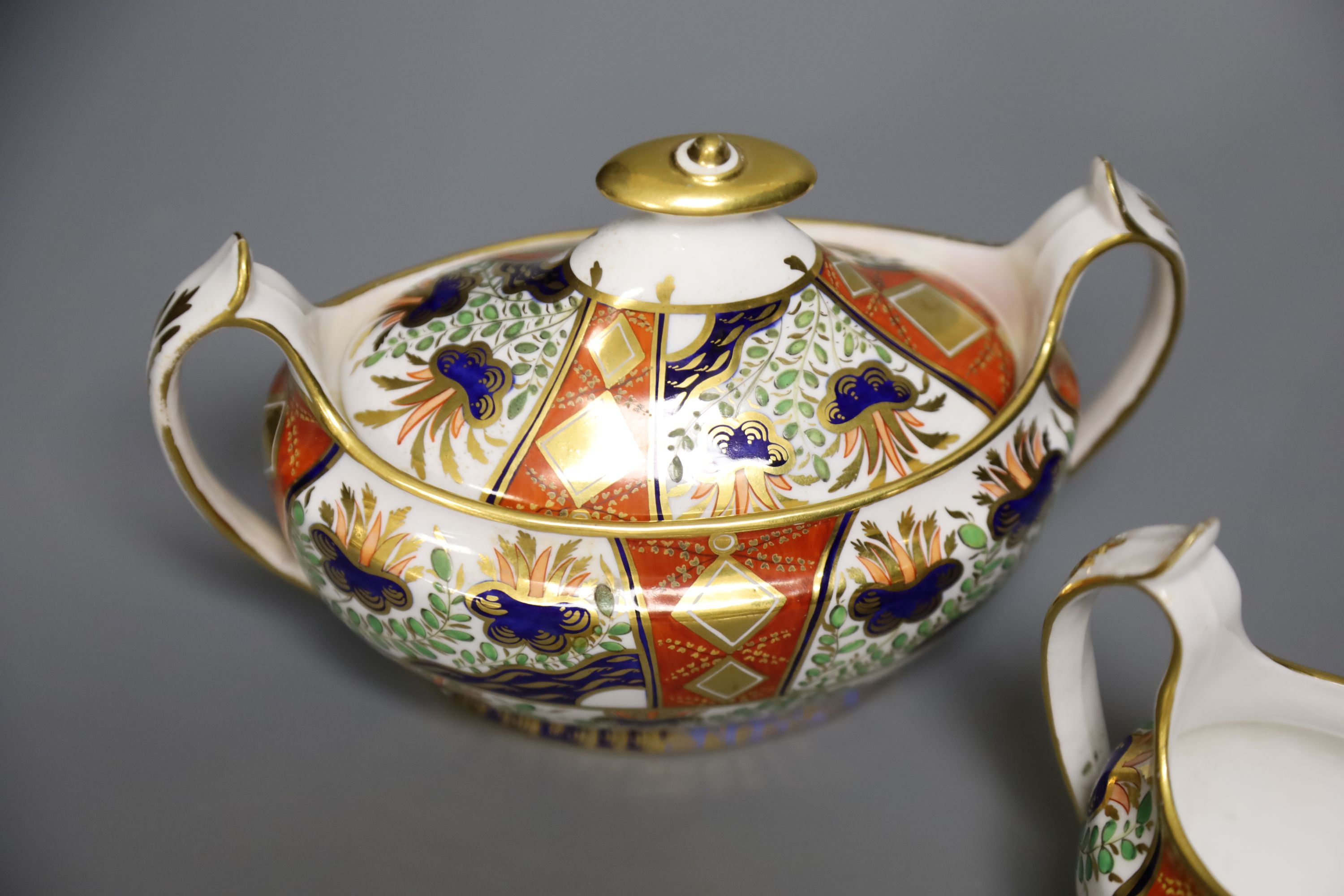 A Spode sucrier and cover painted in imari style with pattern 2213 and a matching 2213 cream jug